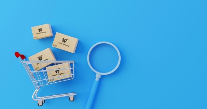 Online shopping concept. Web or mobile application ecommerce. Top view of carton paper box with shopping cart and magnifying glass on blue background. 3d rendering